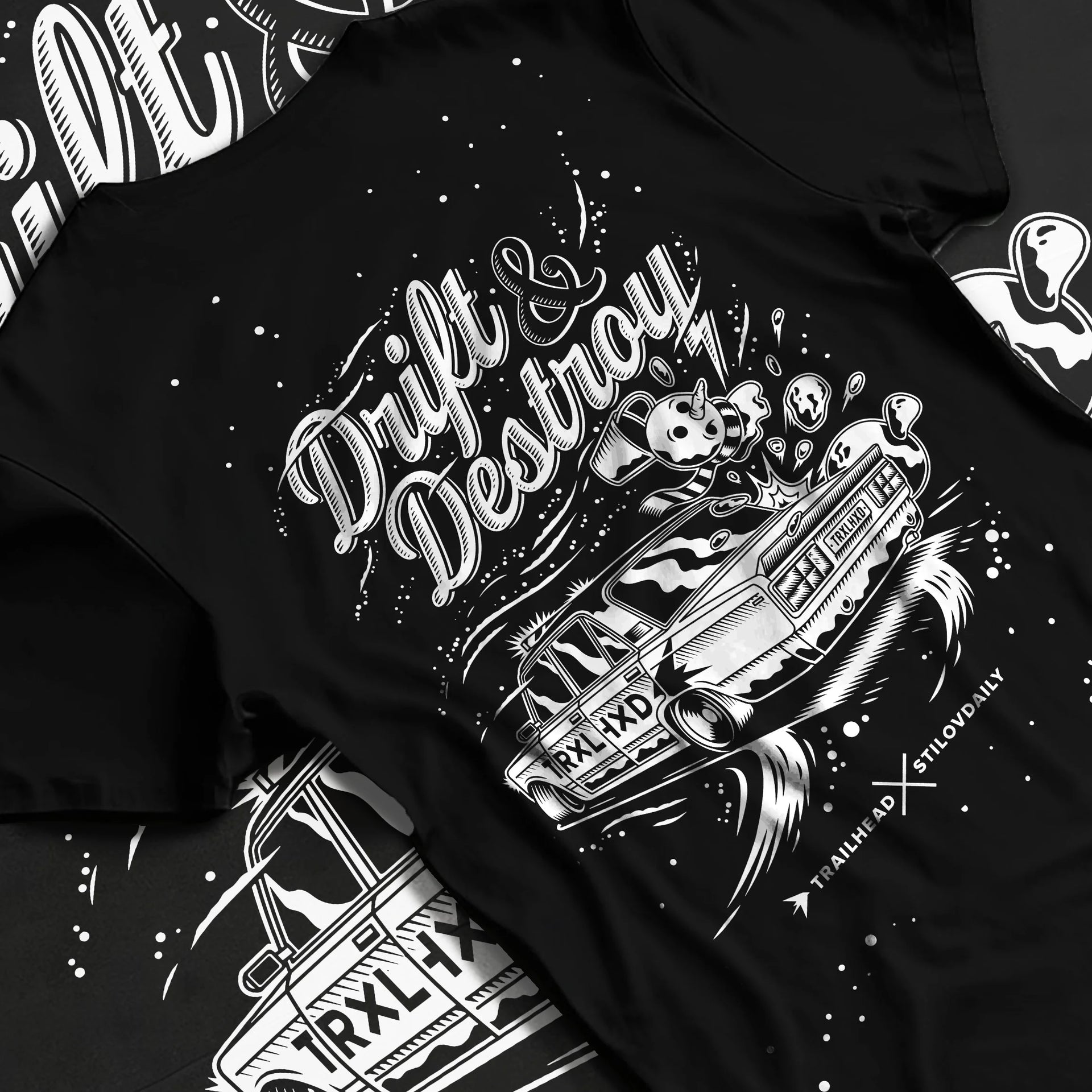 Black T-shirt laid flat with natural fabric folds, featuring racing drift street retro performance motorsport automotive graphic.