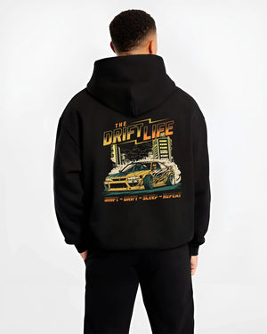 Black hoodie worn by a male model, back view, featuring racing drift jdm street retro vintage performance motorsport graphic.