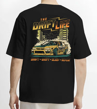 Black T-shirt worn by a male model, back view, featuring racing drift jdm street retro vintage performance motorsport graphic.