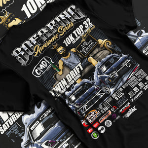 Black T-shirt laid flat with natural fabric folds, featuring racing drift jdm tuner street enthusiast show performance graphic.