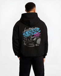 Black hoodie worn by a male model, back view, featuring drift jdm tuner street enthusiast racing performance motorsport graphic.