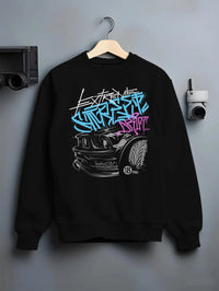 Black crewneck sweatshirt on a hanger against a grey wall, featuring drift jdm tuner street enthusiast racing performance graphic.