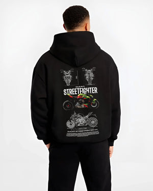 Black hoodie worn by a male model, back view, featuring Ducati Streetfighter racing street performance motorsport graphic.