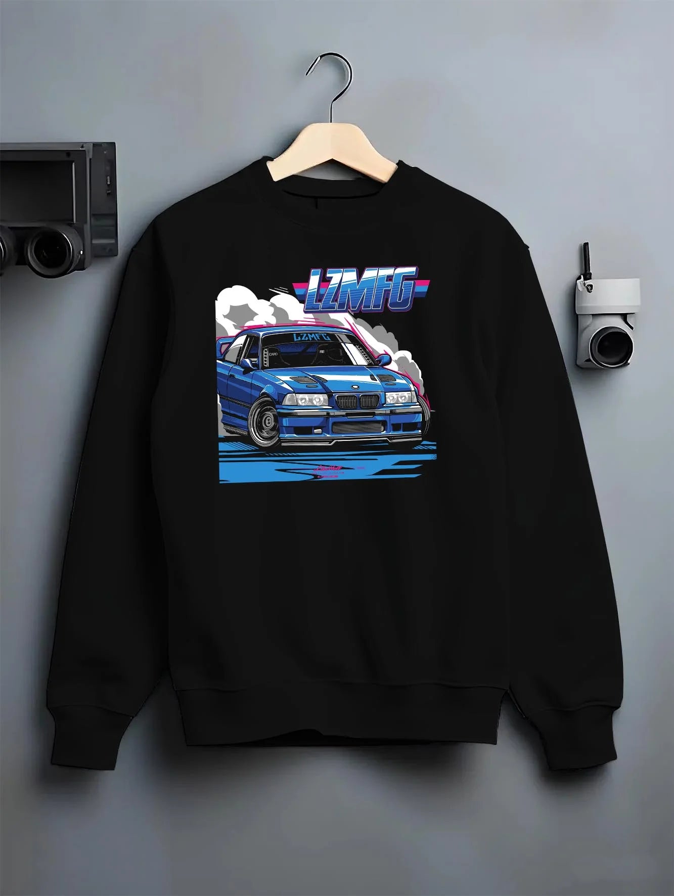 Black crewneck sweatshirt on a hanger against a grey wall, featuring BMW rs turbo racing drift motorsport euro german e12cls.