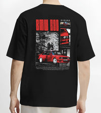 Black T-shirt worn by a male model, back view, featuring BMW rs turbo racing drift motorsport euro german street retro graphic.