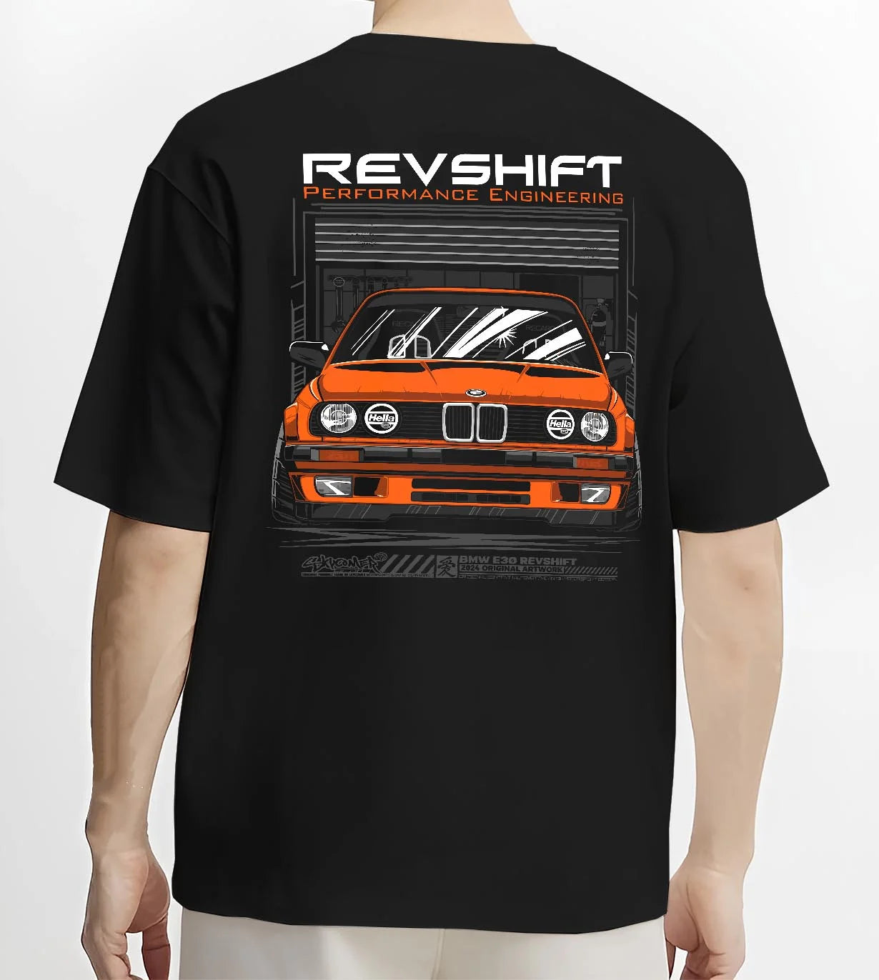 Black T-shirt worn by a male model, back view, featuring BMW E30 rs motorsport street vintage classic racing graphic.