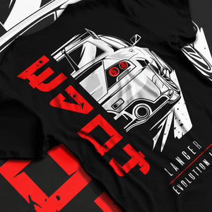 Black T-shirt laid flat with natural fabric folds, featuring Mitsubishi EVO turbo racing drift track jdm street enthusiast graphic.