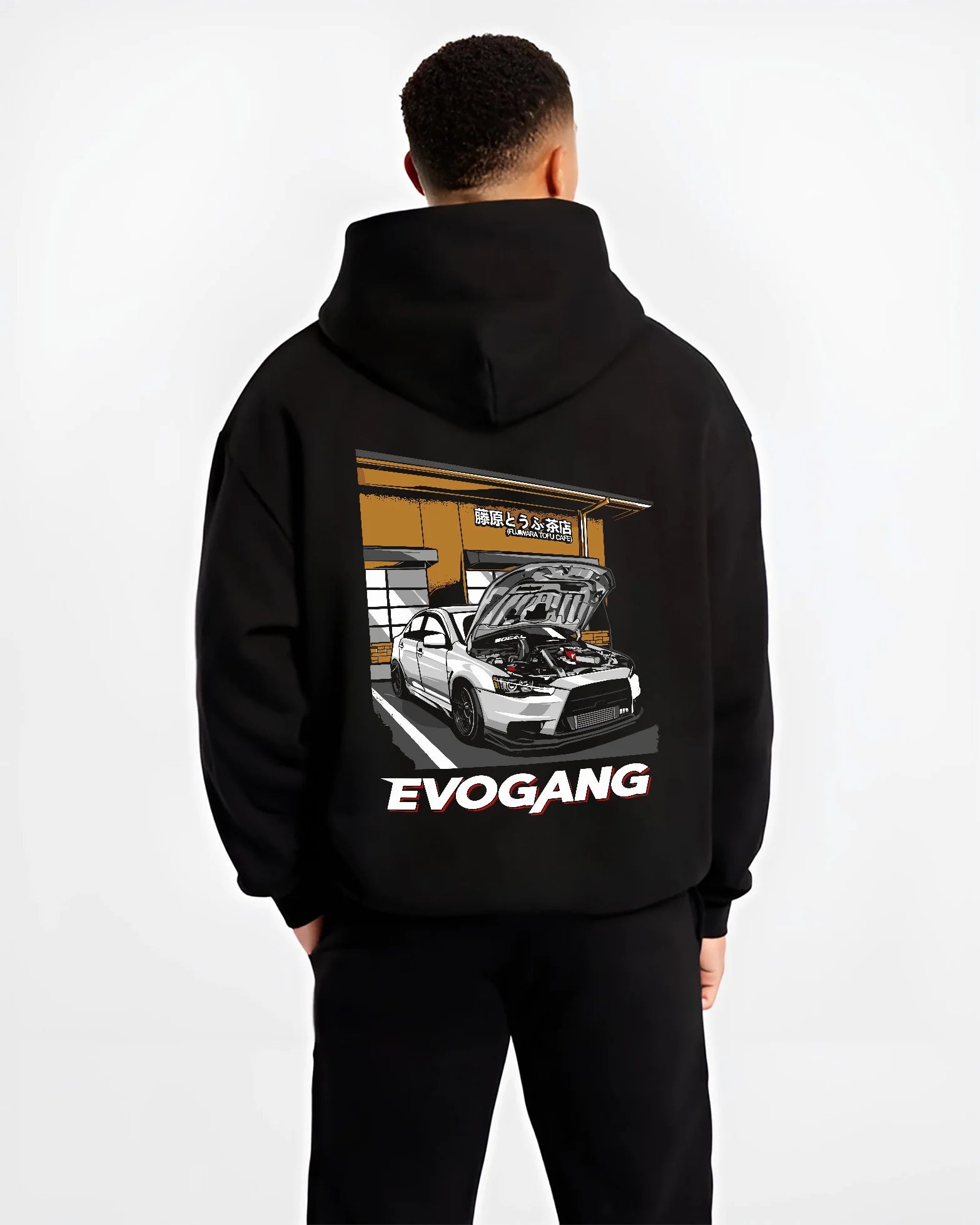 Black hoodie worn by a male model, back view, featuring Mitsubishi EVO rs racing jdm tuner street performance graphic.