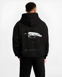 Black hoodie worn by a male model, back view, featuring Ford Mustang rs racing muscle street retro performance graphic.