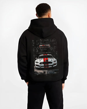 Black hoodie worn by a male model, back view, featuring Ford Mustang rs racing muscle street retro show graphic.