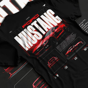 Black T-shirt laid flat with natural fabric folds, featuring Ford Mustang v8 american muscle street classic iconic power graphic.