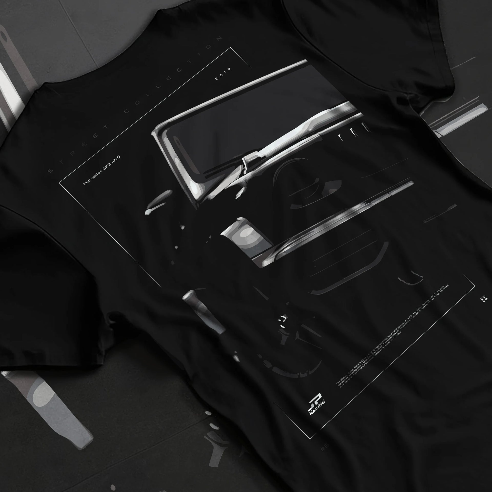 Black T-shirt laid flat with natural fabric folds, featuring Mercedes-Benz AMG rs racing street performance motorsport graphic.