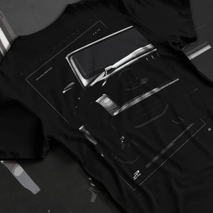Black T-shirt laid flat with natural fabric folds, featuring Mercedes-Benz AMG rs racing street performance motorsport graphic.