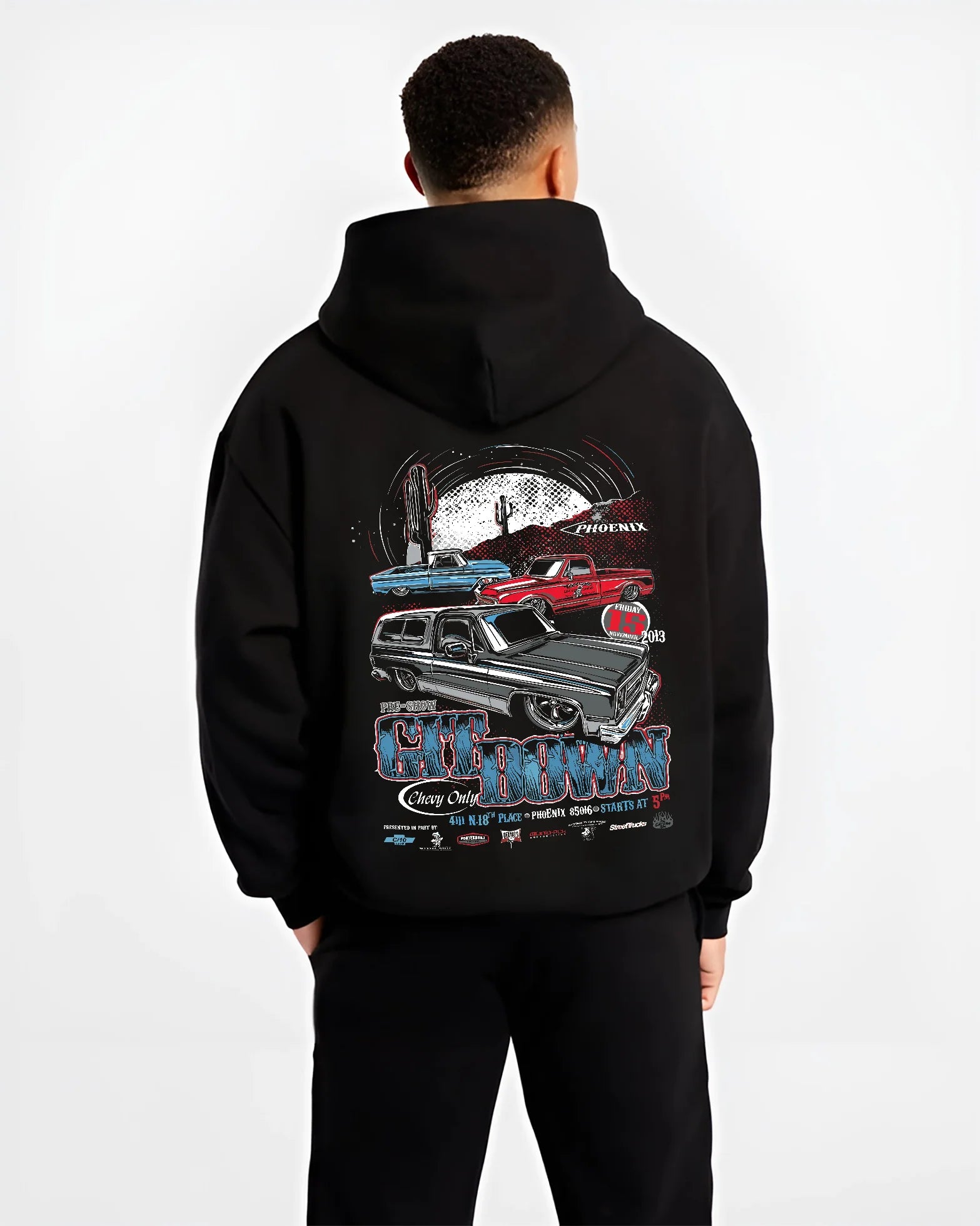Black hoodie worn by a male model, back view, featuring Chevrolet retro vintage classic enthusiast show racing street graphic.