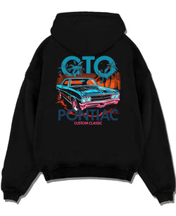 Black pullover hoodie laid flat on a white background, featuring Pontiac GTO muscle street retro vintage classic enthusiast graphic.