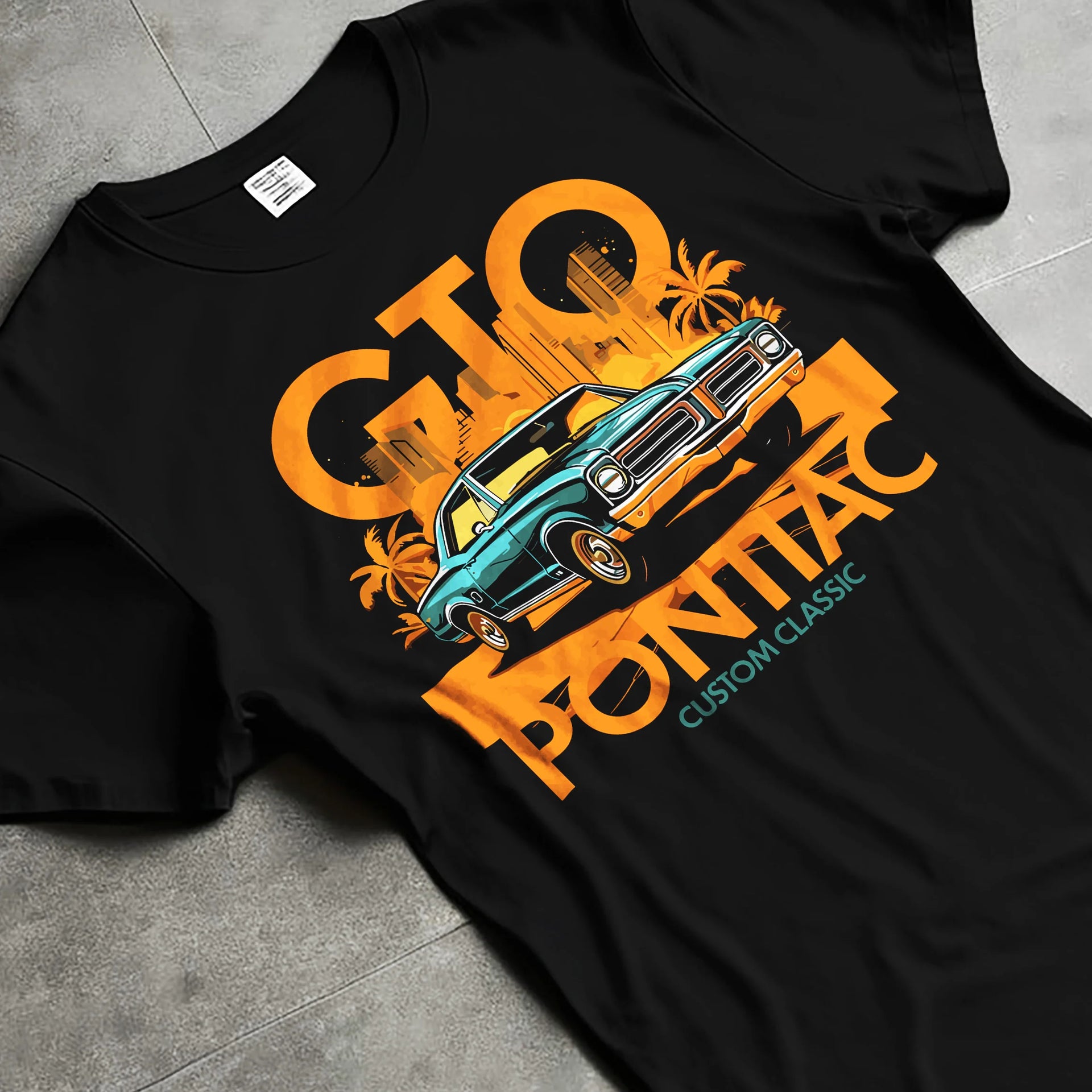 Black T-shirt laid flat with natural fabric folds, featuring Pontiac GTO rs muscle street retro vintage classic graphic.