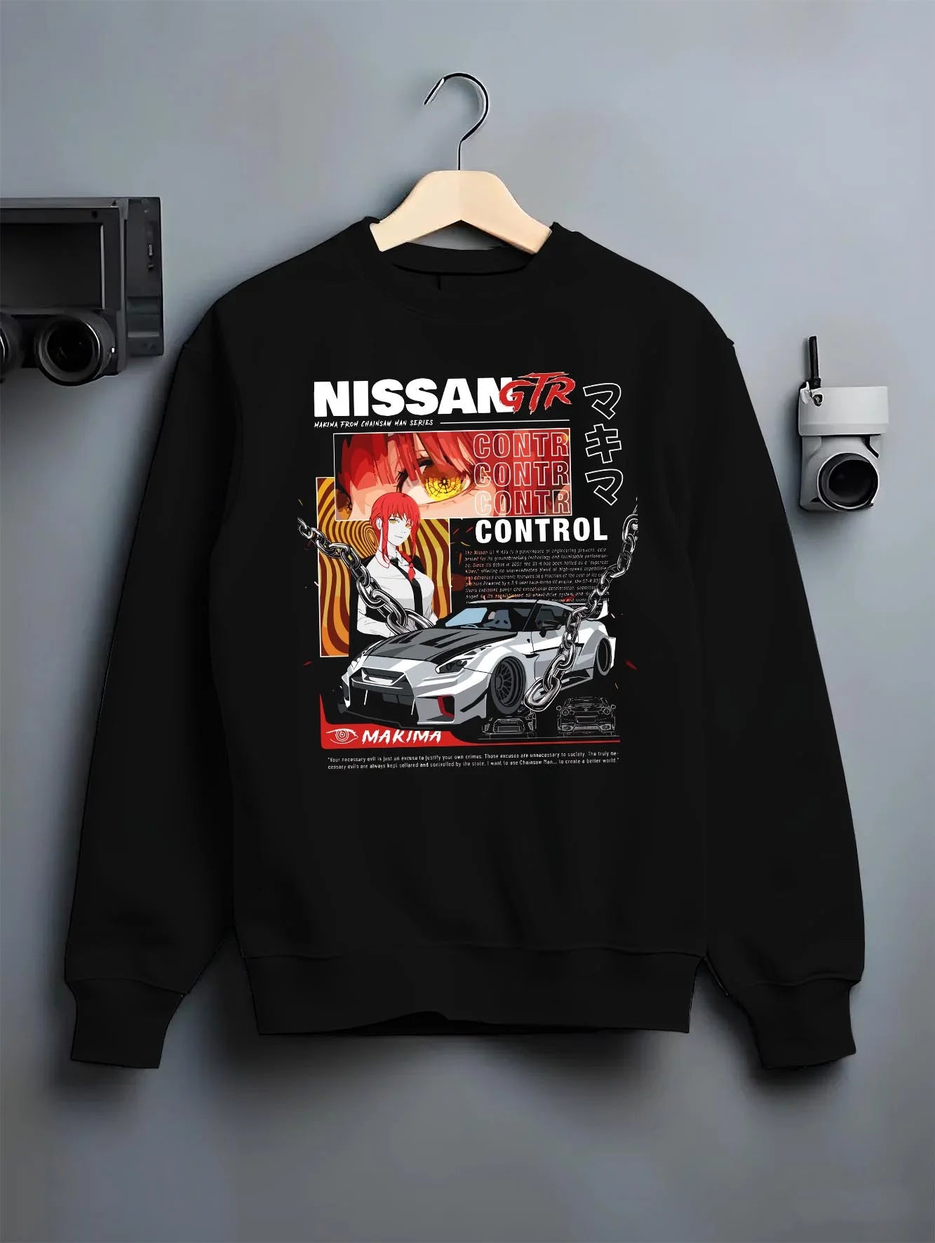 Black crewneck sweatshirt on a hanger against a grey wall, featuring Nissan Skyline R34 gtr r34 skyline turbo turbocharged graphic.