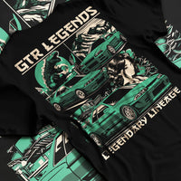Black T-shirt laid flat with natural fabric folds, featuring SKYLINE gtr r32 r34 drift jdm street retro legend legendary graphic.