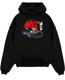 Black pullover hoodie laid flat on a white background, featuring Nissan Skyline R34 r34 skyline drift jdm japanese street graphic.