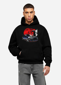 Black hoodie worn by a male model, front view, featuring Nissan Skyline R34 r34 skyline drift jdm japanese street graphic.
