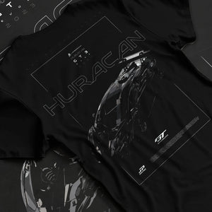 Black T-shirt laid flat with natural fabric folds, featuring Lamborghini Huracan gt3 evo racing enthusiast street graphic.