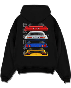 Black pullover hoodie laid flat on a white background, featuring drift jdm japanese tuner legend racing street performance graphic.
