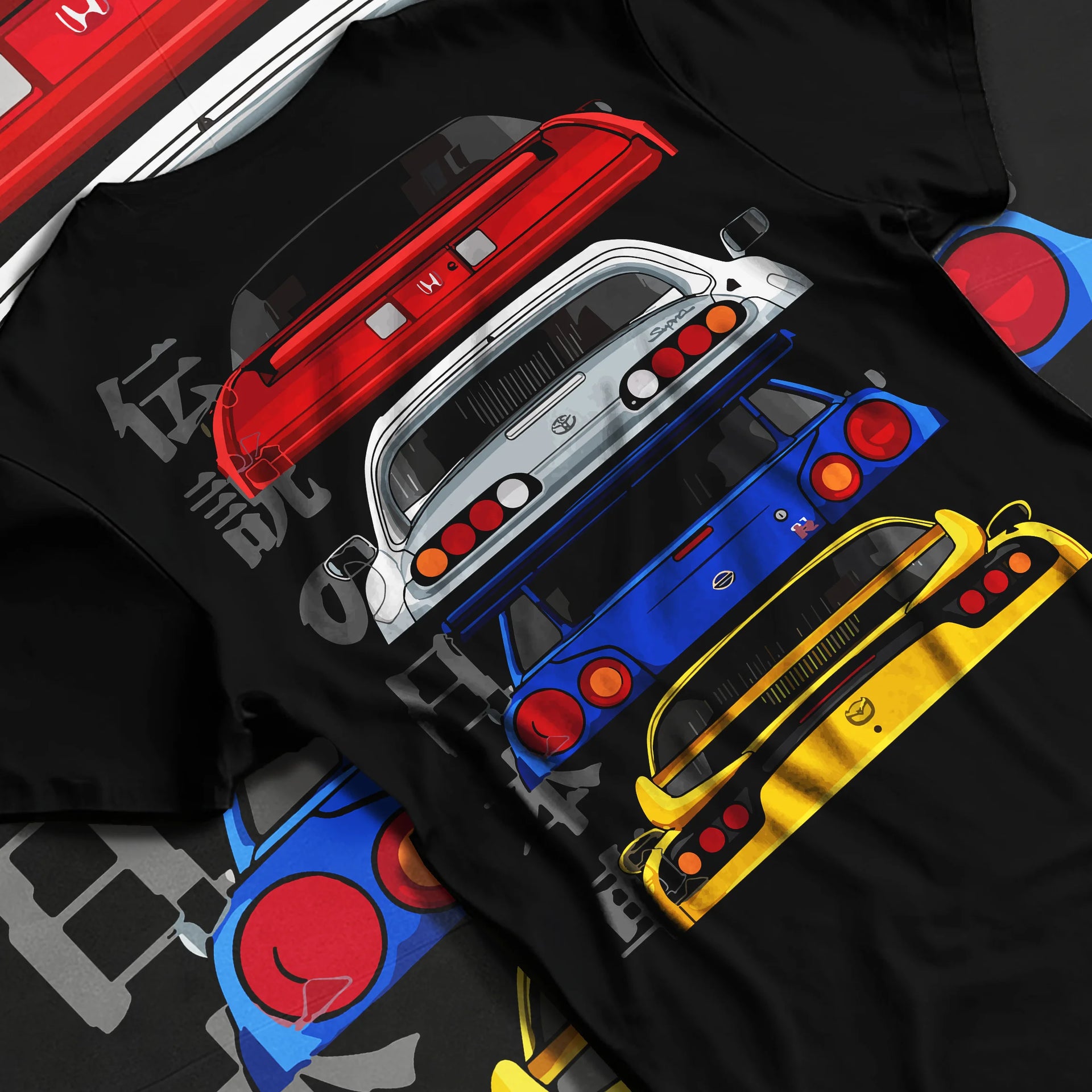 Black T-shirt laid flat with natural fabric folds, featuring drift jdm japanese tuner legend racing street performance graphic.