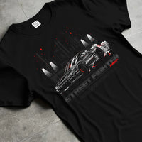 Black T-shirt laid flat with natural fabric folds, featuring rs racing drift jdm tuner street enthusiast performance graphic.
