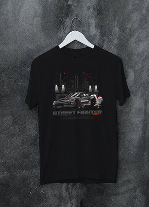 Black crewneck T-shirt on a hanger against a grey wall, featuring rs racing drift jdm tuner street enthusiast performance graphic.