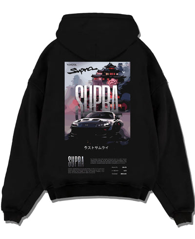 Black pullover hoodie laid flat on a white background, featuring Toyota Supra racing jdm japanese enthusiast street graphic.