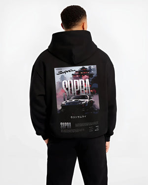 Black hoodie worn by a male model, back view, featuring Toyota Supra racing jdm japanese enthusiast street performance graphic.