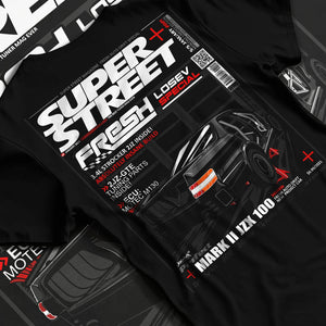 Black T-shirt laid flat with natural fabric folds, featuring Toyota JZX100 turbo drift street racing performance motorsport graphic.
