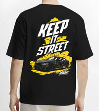 Black T-shirt worn by a male model, back view, featuring turbo racing drift tuner street performance motorsport automotive graphic.