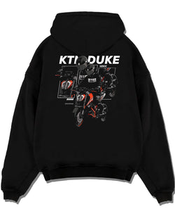 Black pullover hoodie laid flat on a white background, featuring KTM rs racing street performance motorsport automotive graphic.