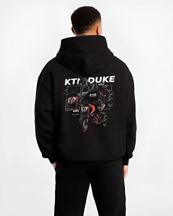 Black hoodie worn by a male model, back view, featuring KTM rs racing street performance motorsport automotive enthusiast graphic.