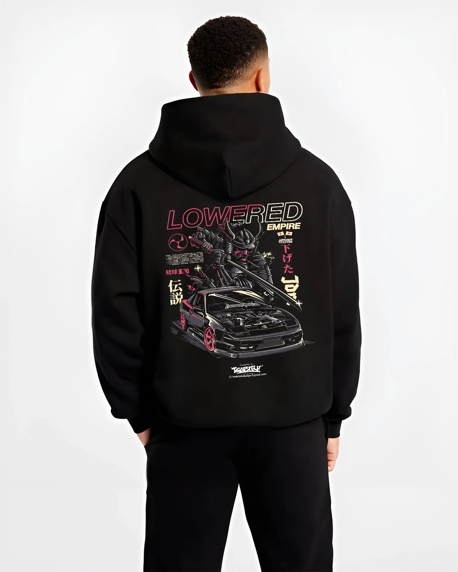Black hoodie worn by a male model, back view, featuring drift drifting japanese tuner lowered street racing performance graphic.