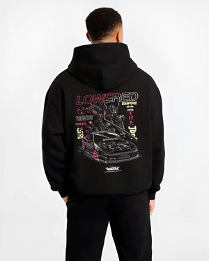 Black hoodie worn by a male model, back view, featuring drift drifting japanese tuner lowered street racing performance graphic.