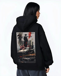 Black hoodie worn by a female model, back view, featuring Toyota Supra racing jdm japanese tuning street enthusiast graphic.