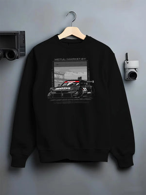 Black crewneck sweatshirt on a hanger against a grey wall, featuring BMW M4 rs turbo racing motorsport german street graphic.