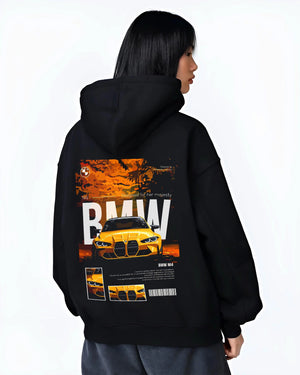 Black hoodie worn by a female model, back view, featuring BMW M4 racing drift street performance motorsport automotive graphic.