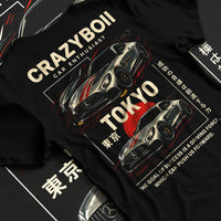 Black T-shirt laid flat with natural fabric folds, featuring Mercedes-Benz drift euro german street enthusiast racing graphic.