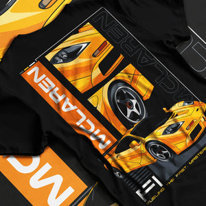 Black T-shirt laid flat with natural fabric folds, featuring McLaren 720S rs racing enthusiast street performance graphic.