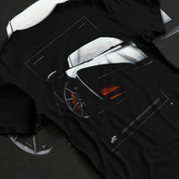 Black T-shirt laid flat with natural fabric folds, featuring McLaren F1 rs racing street retro speed enthusiast graphic.