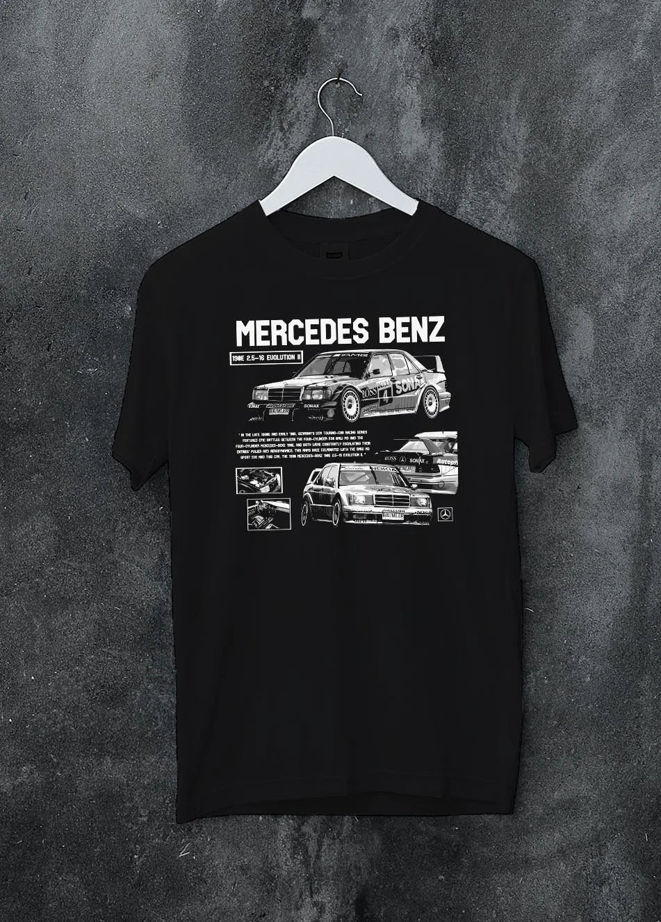 Black crewneck T-shirt on a hanger against a grey wall, featuring Mercedes-Benz AMG rs racing motorsport street enthusiast graphic.