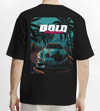 Black T-shirt worn by a male model, back view, featuring Mercedes-Benz street retro racing performance motorsport graphic.