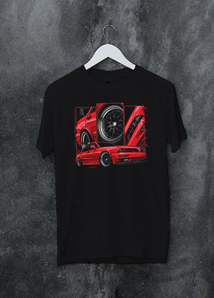 Black crewneck T-shirt on a hanger against a grey wall, featuring street retro racing performance motorsport automotive graphic.