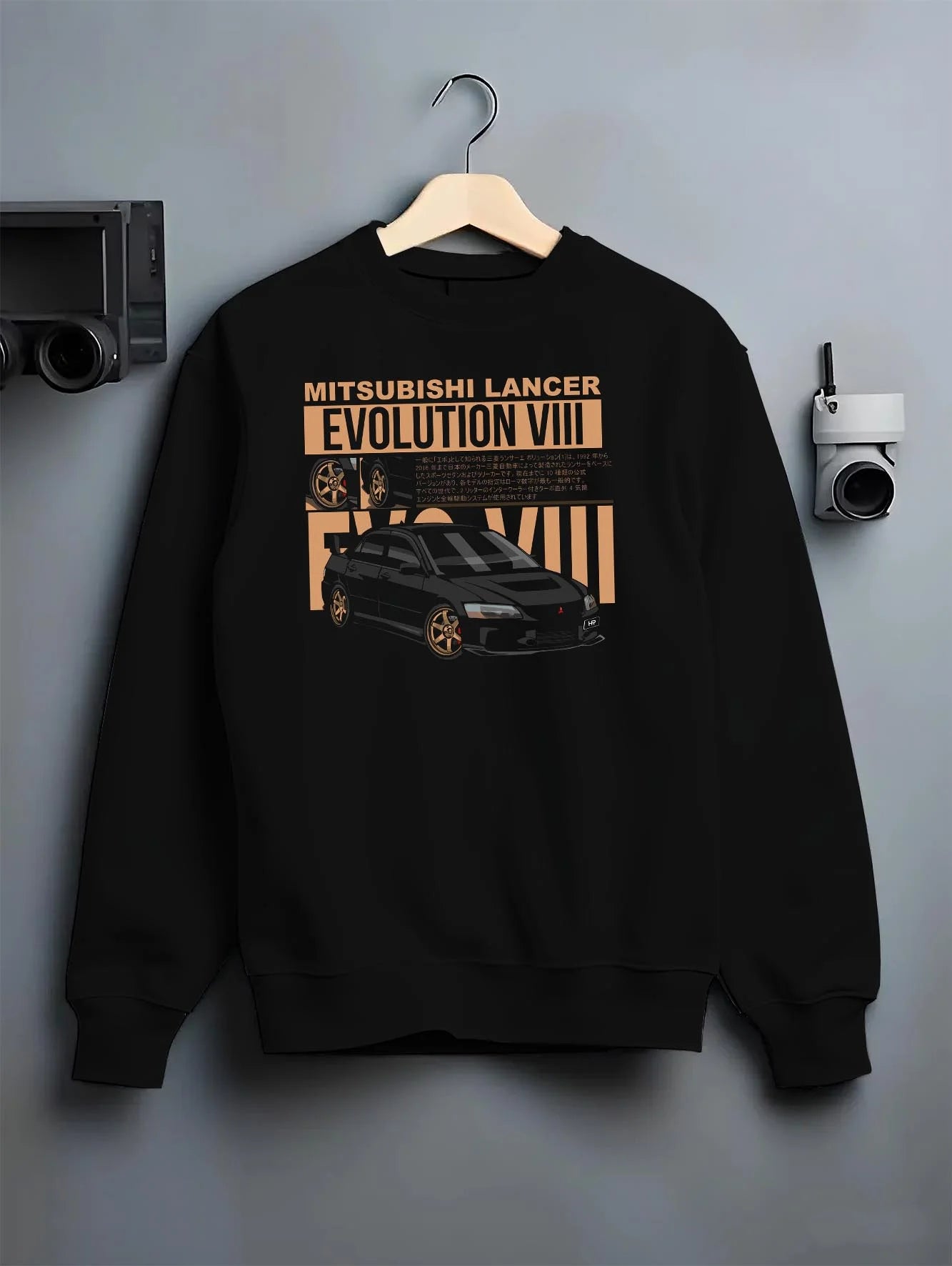 Black crewneck sweatshirt on a hanger against a grey wall, featuring street retro racing performance motorsport automotive miami4.