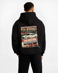 Black hoodie worn by a male model, back view, featuring Mitsubishi EVO turbo racing drift jdm japanese tuner street graphic.