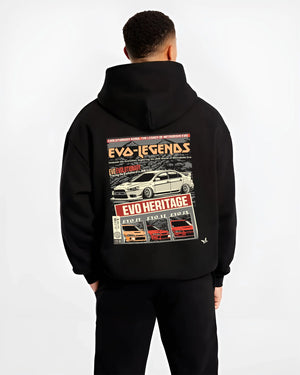 Black hoodie worn by a male model, back view, featuring Mitsubishi EVO turbo racing drift jdm japanese tuner street graphic.