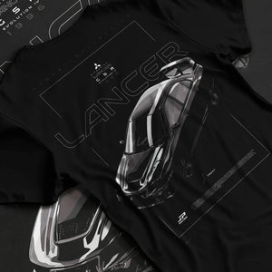 Black T-shirt laid flat with natural fabric folds, featuring Mitsubishi Lancer evo turbo racing drift jdm japanese street graphic.